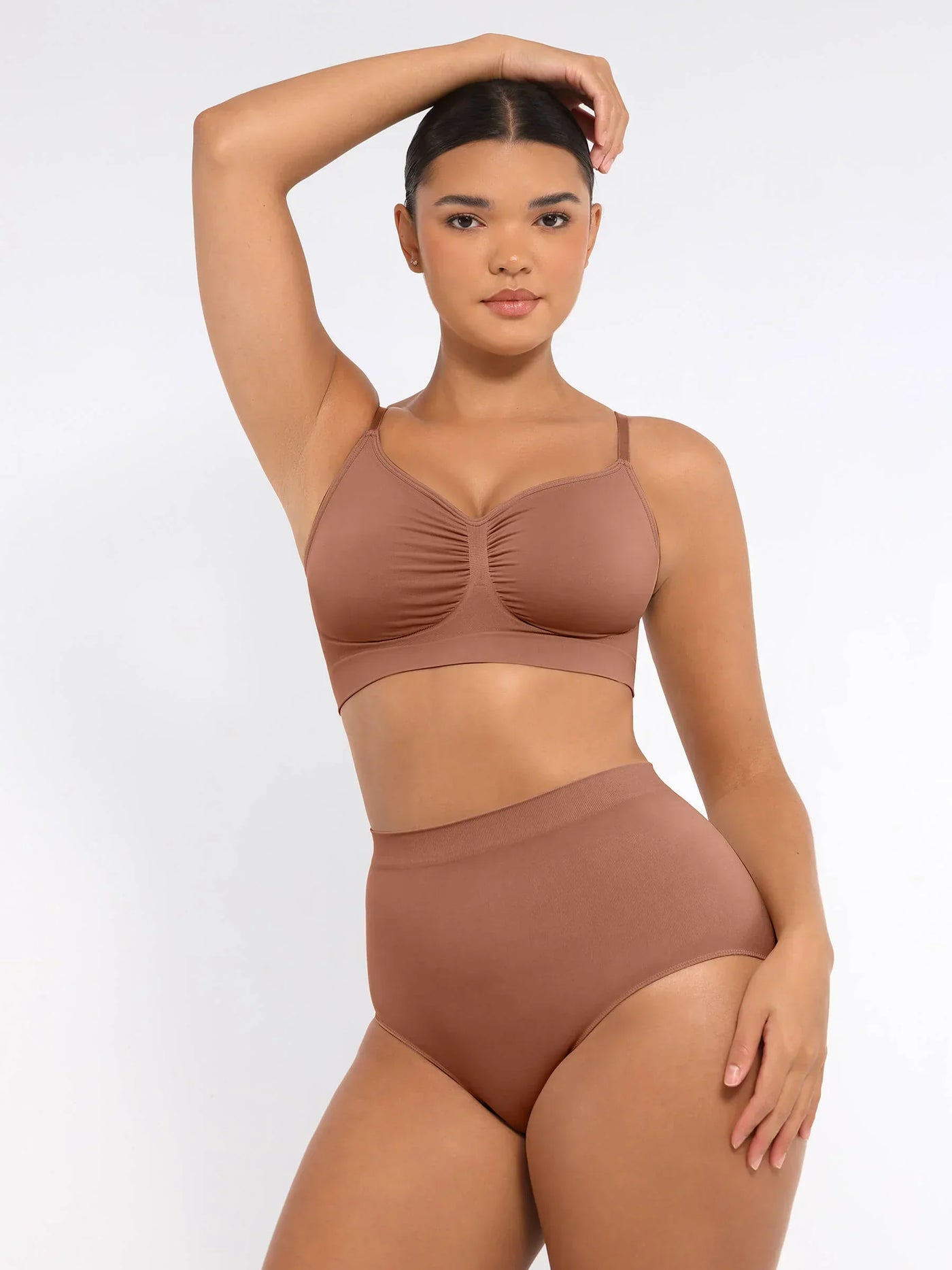 Woman wearing Formivelle CloudSkin seamless brown bra and high-waisted shapewear briefs